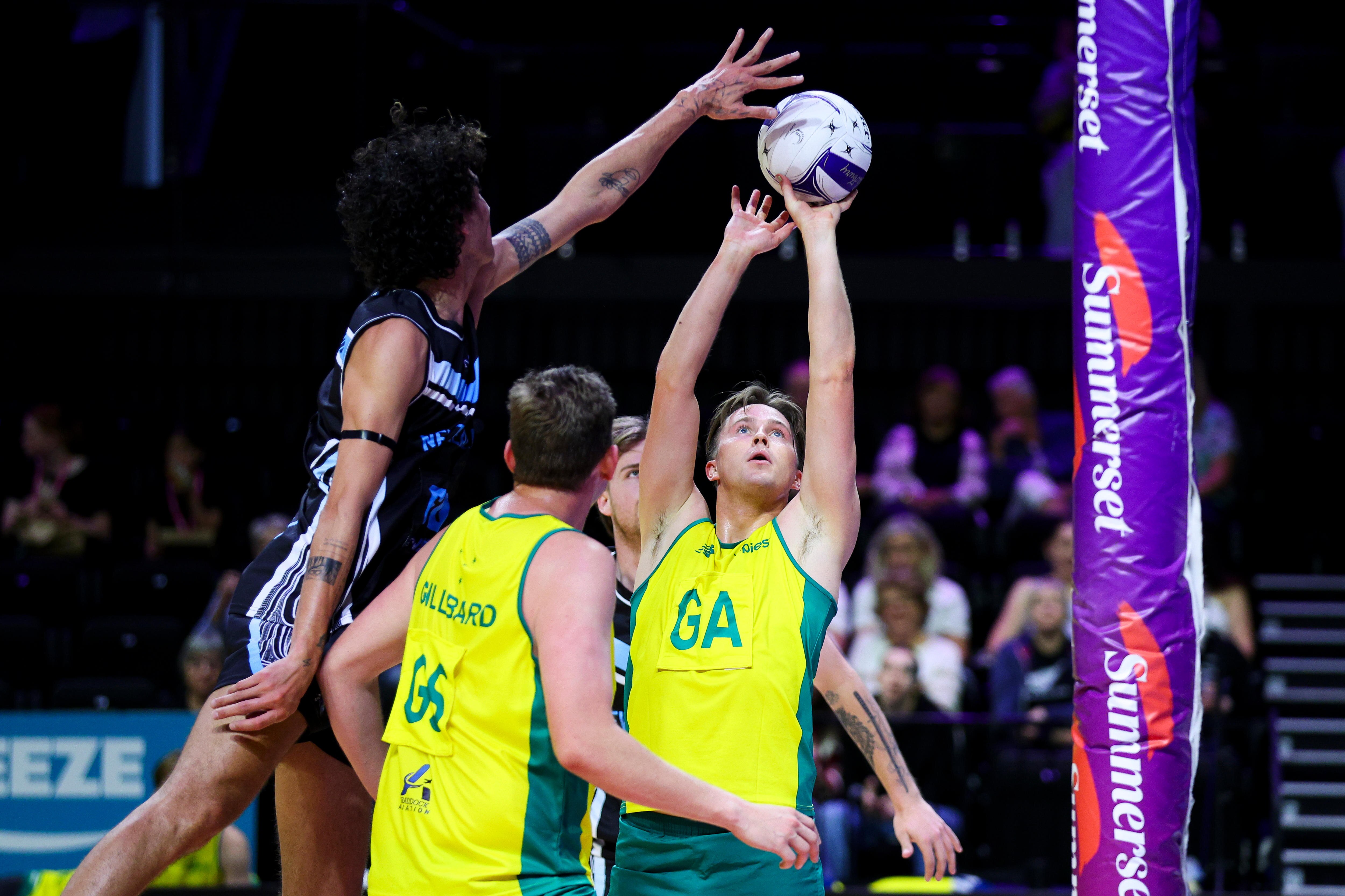 Brodie Roberts has a shot on goal for Australia against New Zealand in the men's netball Test.