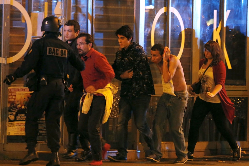 French special forces evacuate people from the Bataclan theatre in Paris.