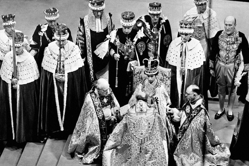 A black and white photo of Queen Elizabeth II's coronation at Westminster Abbey.