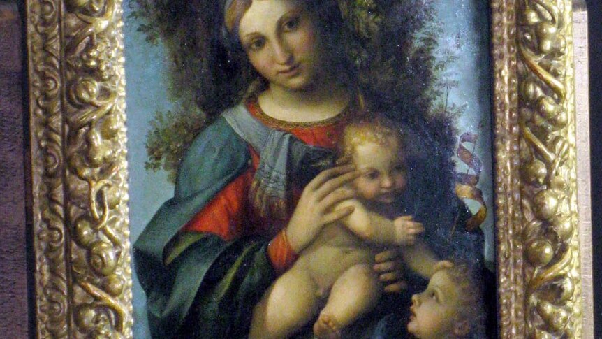 Madonna and child with the infant Saint John the Baptist sits on show