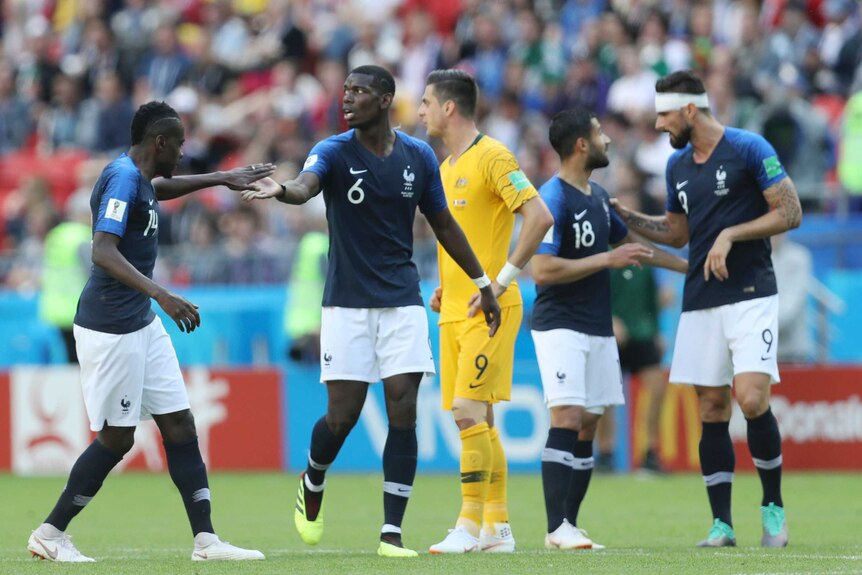 Paul Pogba celebrates with teammates after scoring against Australia