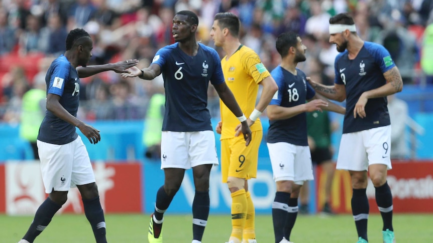 Paul Pogba celebrates with teammates after scoring against Australia