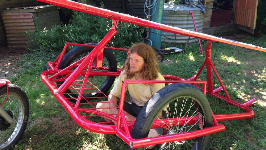 Sam Mitchell rode his self-made solar panel bike.