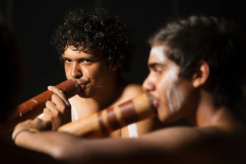 Bremer State High School students play the didgeridoo during a performance at the school, west of Ipswich.