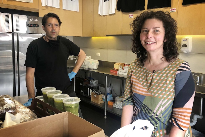 Ben and Dani pose for a picture in the Attica kitchen, surrounded by found and utensils