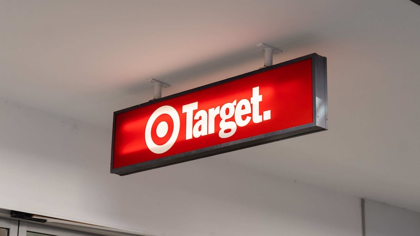 Red Target store sign hanging from the roof/awning outside the shop