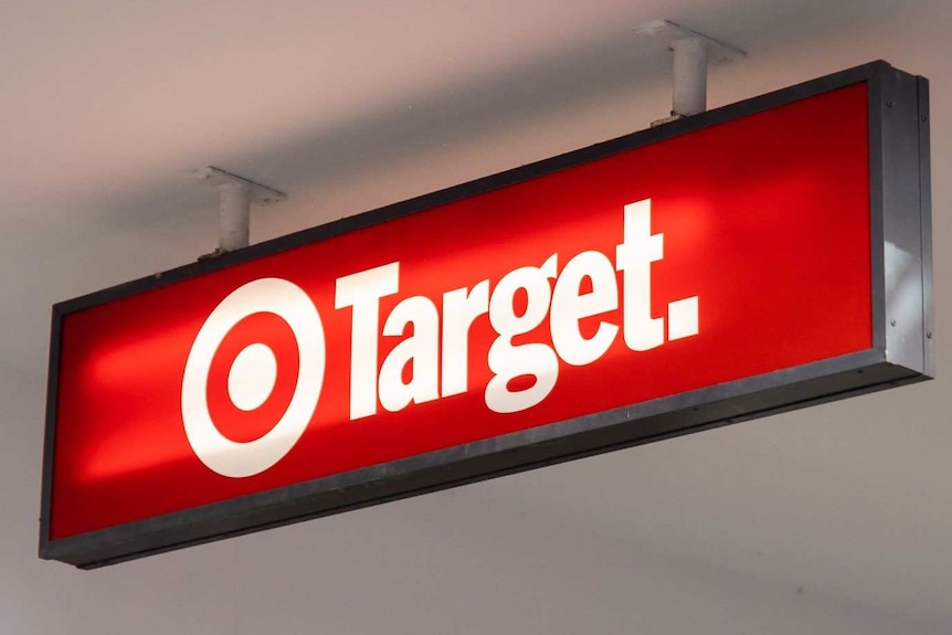 Red Target store sign hanging from the roof/awning outside the shop