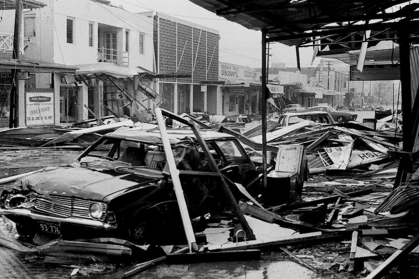 The wreckage of cars and shops on one of Darwin's main streets after Cyclone Tracy