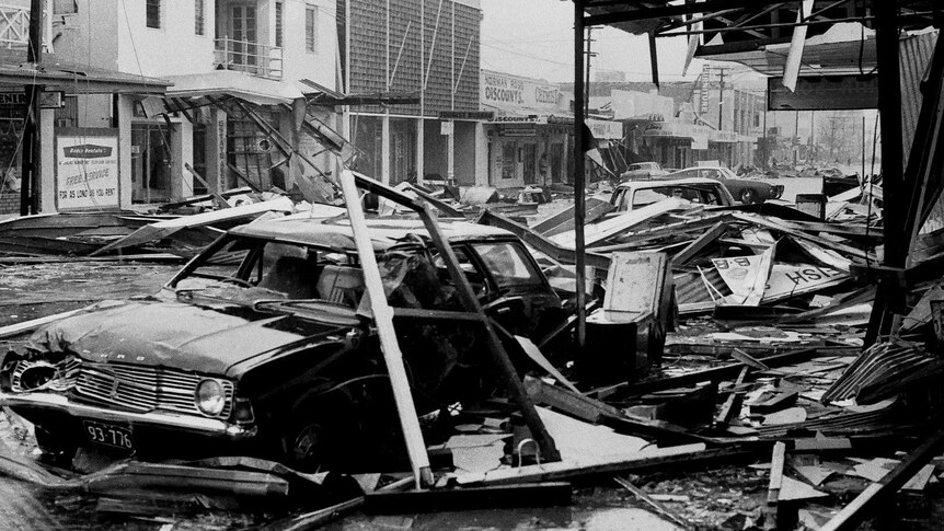 The wreckage of cars and shops on one of Darwin's main streets after Cyclone Tracy