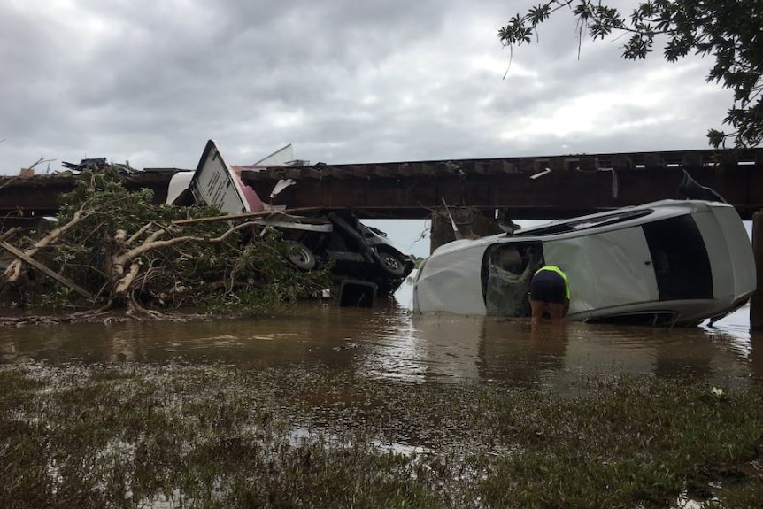 Smashed cars were picked up in a torrent of water and thrown down the street in Murwillumbah.