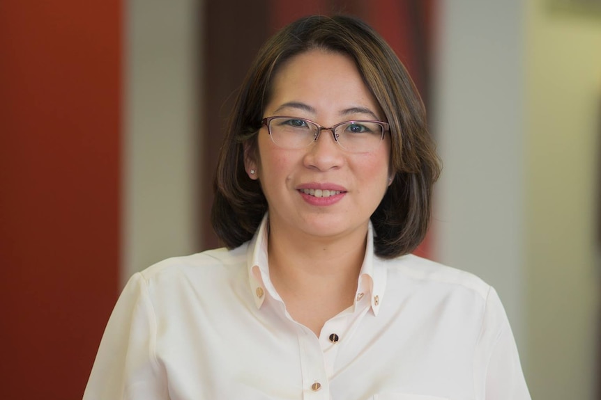 A woman in white shirt. 