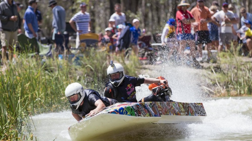 Dinghy Derby competitors race along a creek at Renmark