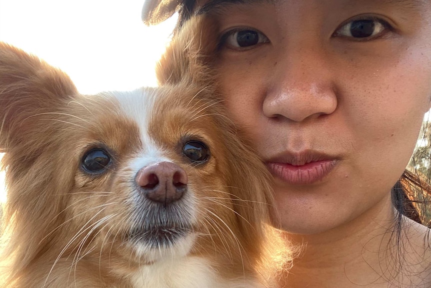 A selfie of a woman and her Pomeranian