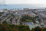 A view of seaside town from a hill 
