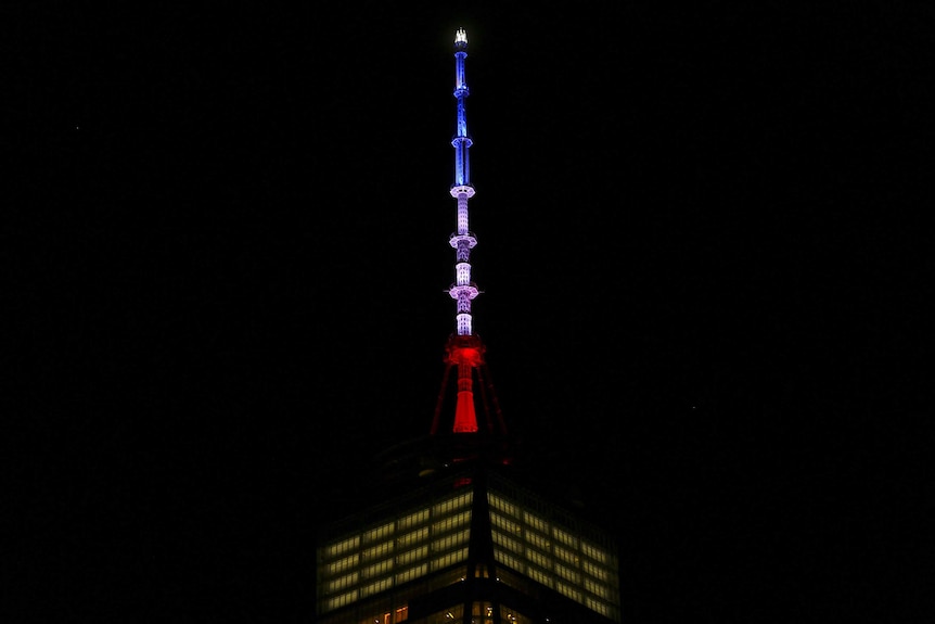 One World Trade Centre lit up in blue, white and red