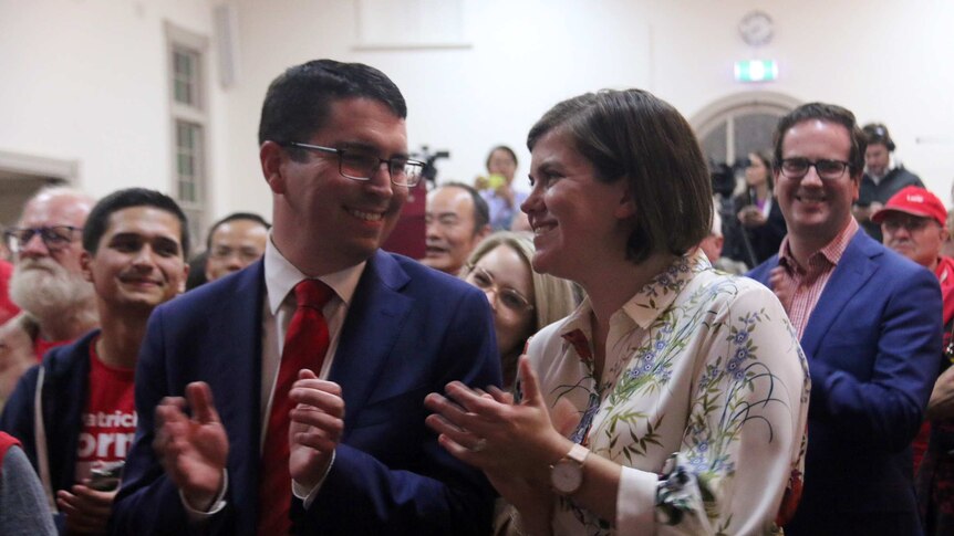 Patrick Gorman and his wife Jess smiling at each other at Labor's victory party.