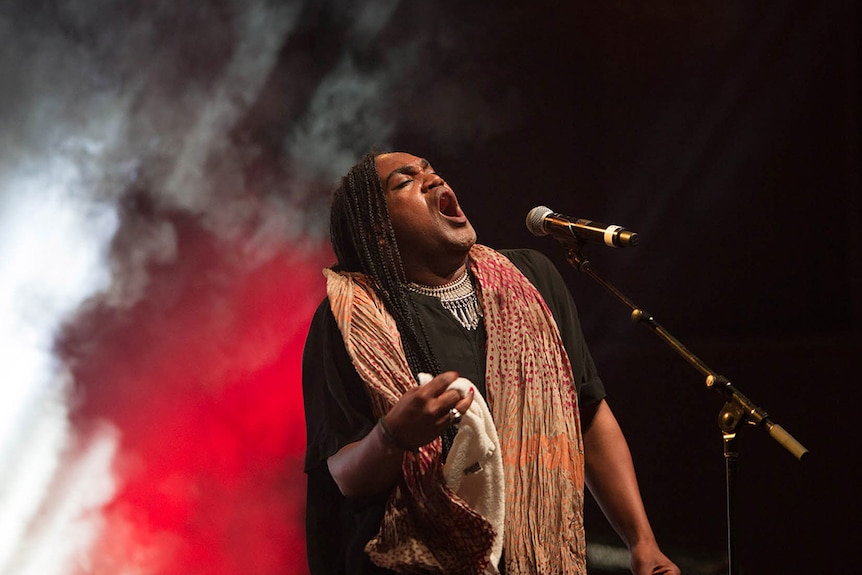 Zaachariaha Fielding of Electric Fields sings on stage at the 2019 NIMAs