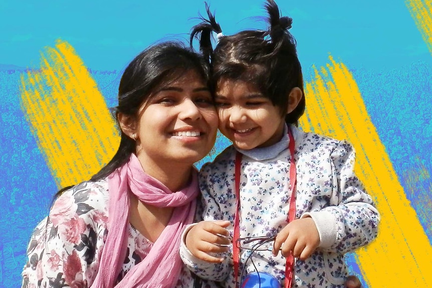 Saba Nabi with her young daughter in front of a blue yellow background