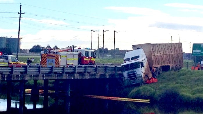 Truck comes off bridge over Preston River, near Bunbury