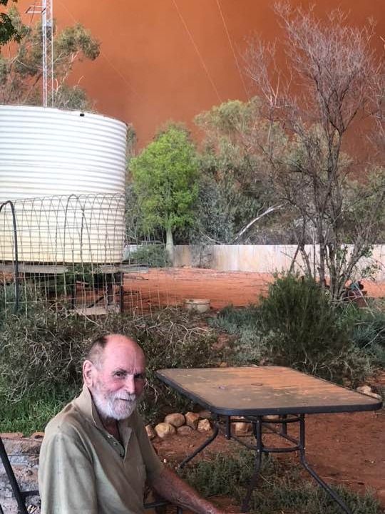 Man in front of dust storm
