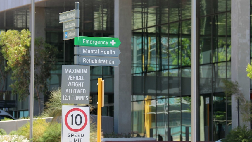 Close up of signpost with emergency, mental, health, rehabilitation at Fiona Stanley Hospital in Perth 7 January 2015