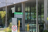 Close up of signpost with emergency, mental, health, rehabilitation at Fiona Stanley Hospital in Perth 7 January 2015