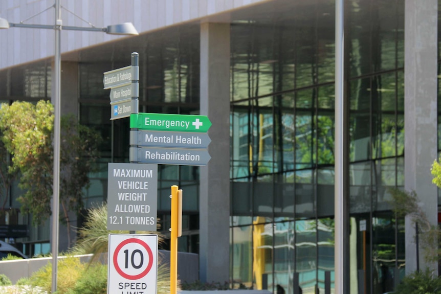 Close up of signpost with emergency, mental, health, rehabilitation outside Fiona Stanley Hospital in Perth