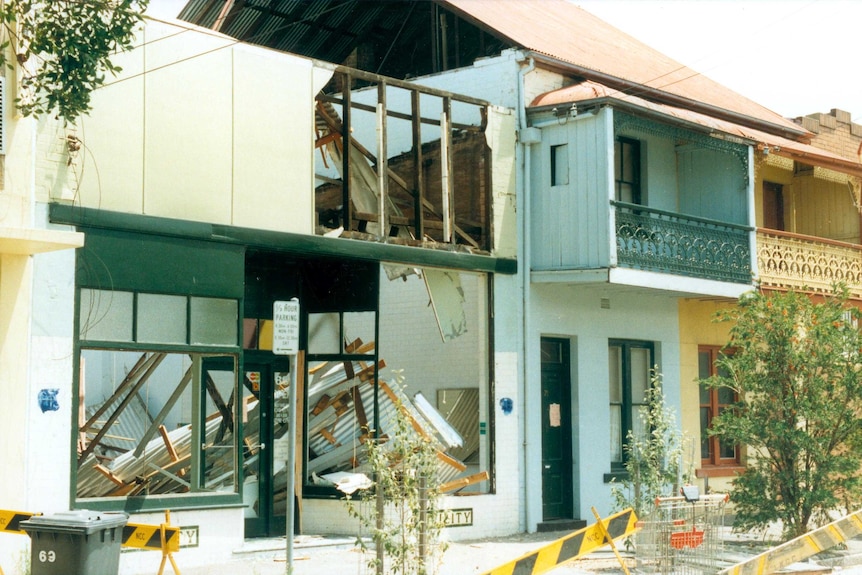 Damaged housing in Laman Street