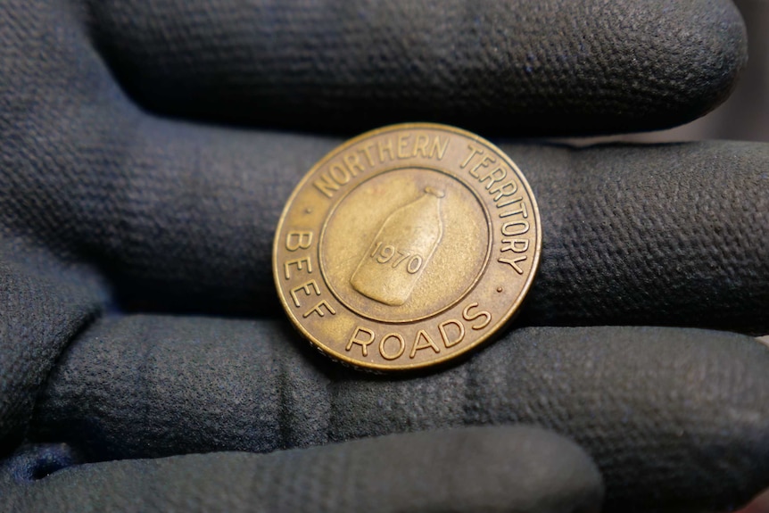 Stubloon coin in Mr Archibald's hand.