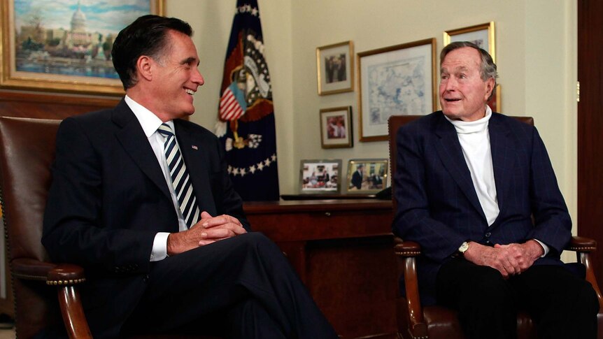 Mitt Romney (left) meets with former president George HW Bush