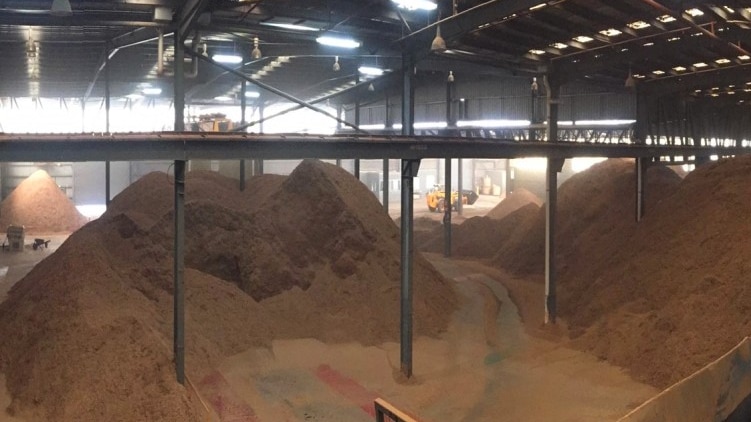 Mountains of harvested poppy crops inside one of three narcotic factories in Australia