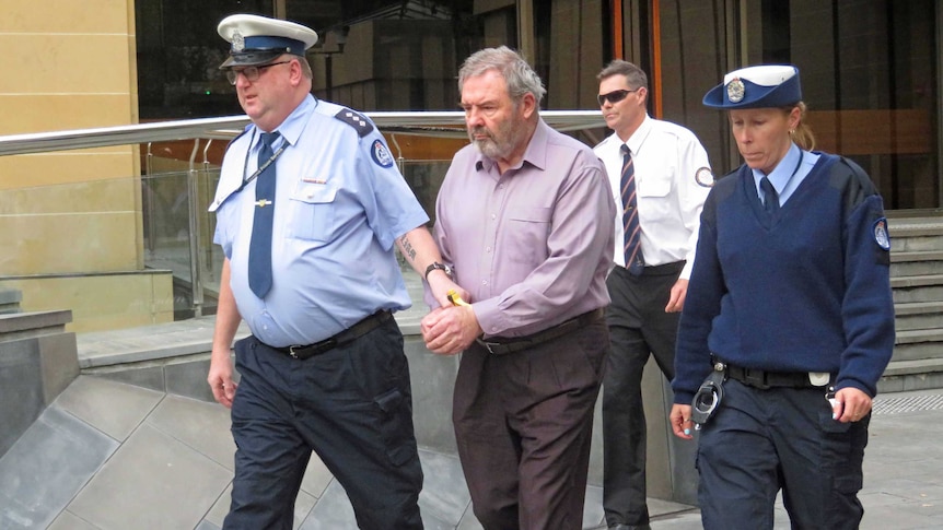 Convicted killer Klaus Neubert leaves the Supreme Court of Tasmania in Hobart.