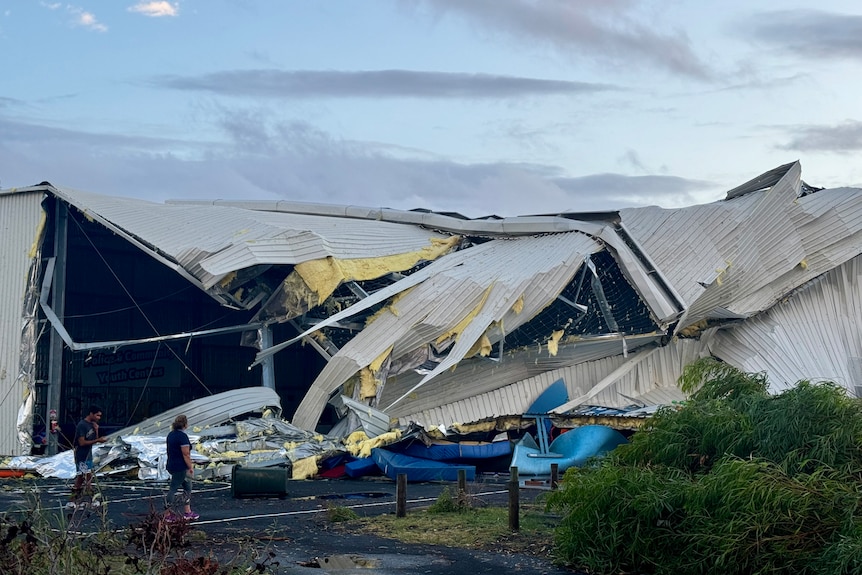 The collapsed roof and twisted metal of the damaged PCYC building in Bunbury.