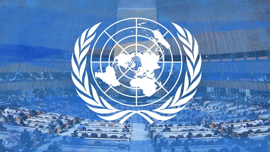 UN logo laid over the hall of the general assembly