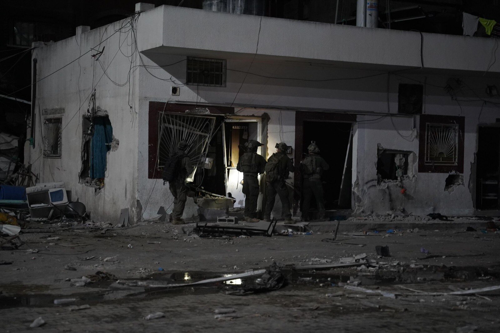 IDF troops move into the Kamal Adwan hospital at night.