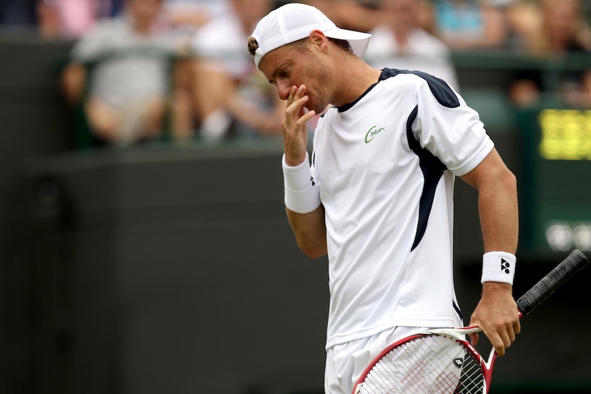 Lleyton Hewitt reacts during his loss to Jo-Wilfried Tsonga at Wimbledon.