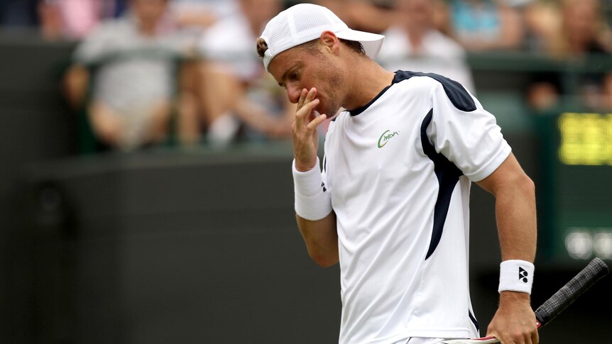 Lleyton Hewitt reacts during his loss to Jo-Wilfried Tsonga at Wimbledon.