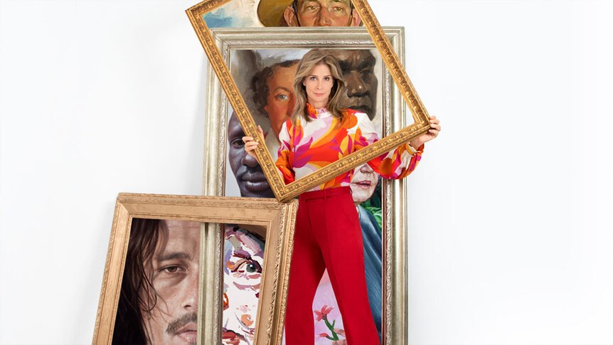 Rachel Griffith holds up painting frame