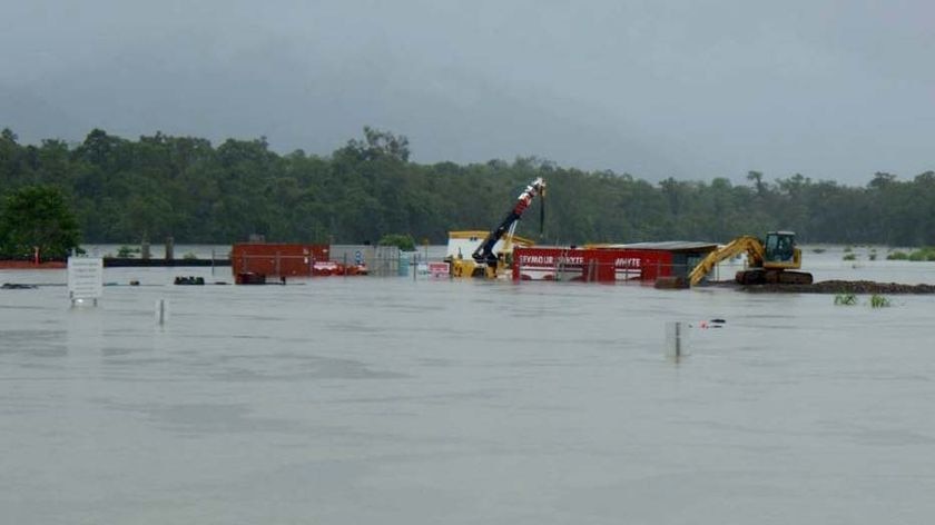 Floodwaters cover the construction site at the Tully River rail bridge