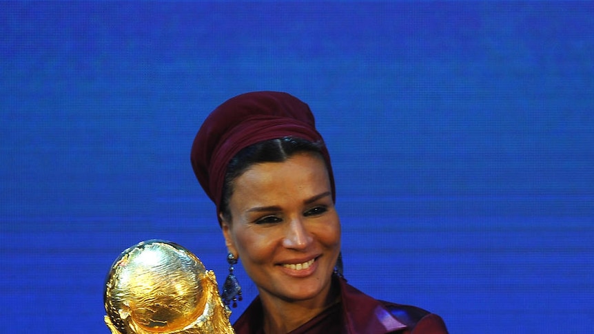 Qatar are presented with the World Cup Tophy by FIFA