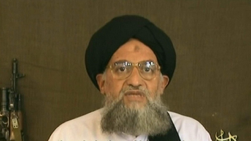 Image grab from video broadcast of Ayman al-Zawahiri with gun in background