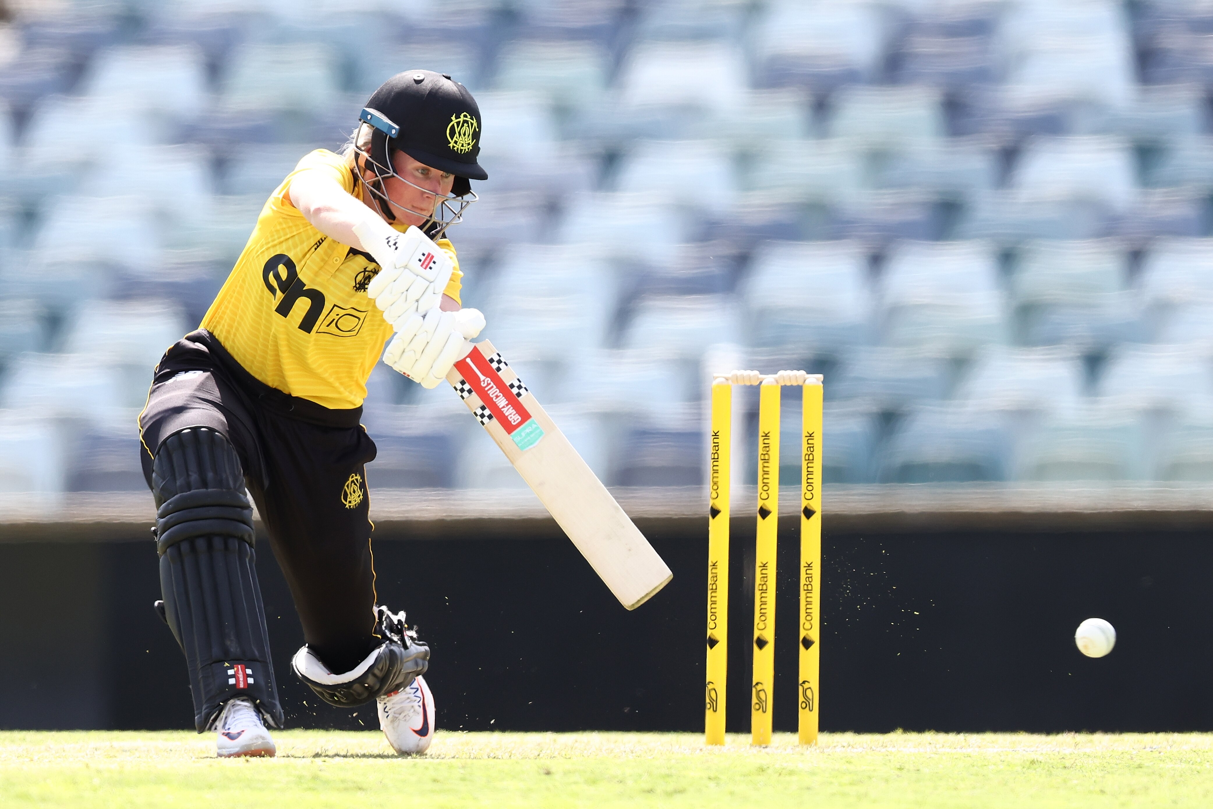 Western Australia's Beth Mooney drives on the off-side in a domestic cricket match.