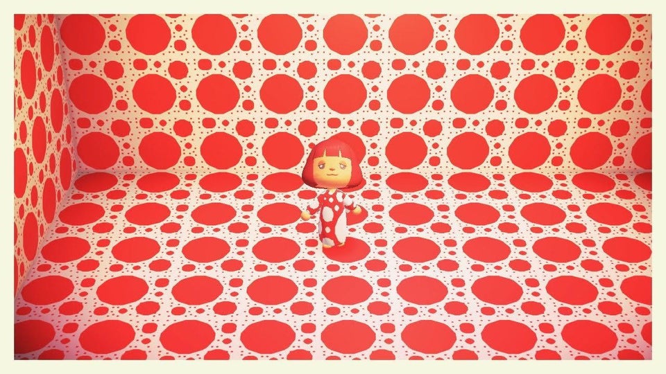 A 3D character with red bob wears white and red polka dot long gown, stands in floor to ceiling red and white polka dot room.