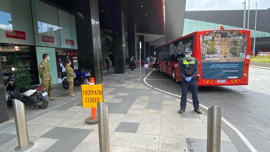 A bus arrives outside a Melbourne quarantine hotel.