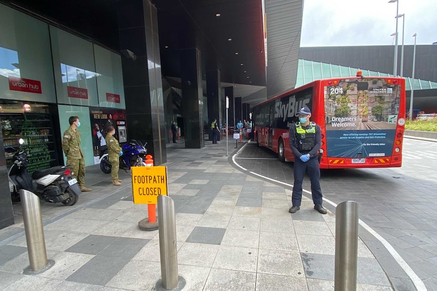 A bus arrives outside a Melbourne quarantine hotel.