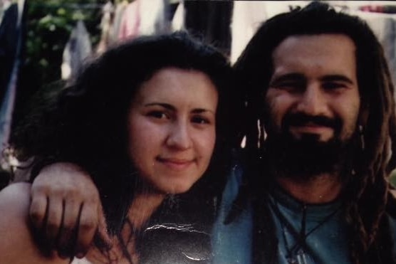 Desi Leary and her brother Steve with their arms around each other, posing for a holiday snap.