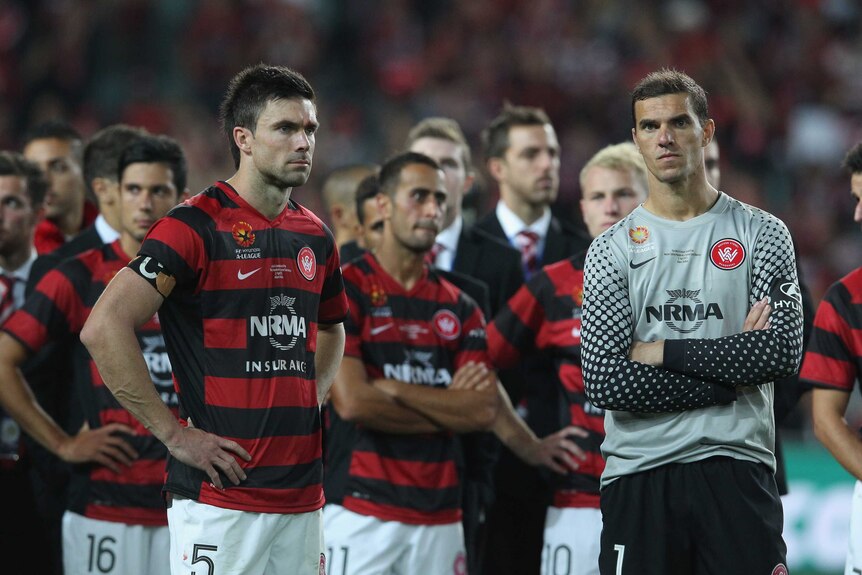 Wanderers Michael Beauchamp and Ante Covic dejected after loss