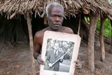 Man from Tanna holds picture of Prince Philip