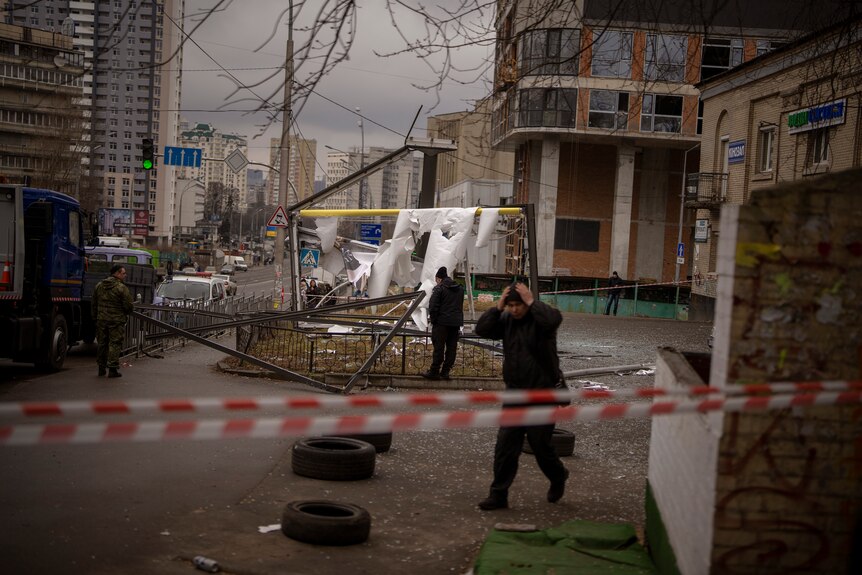 Police officers inspect area after an apparent Russian strike in Kyiv Ukraine.