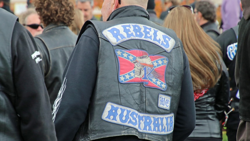 Rebels motorcycle club member wearing colours, undated image.